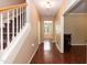 Bright entryway with hardwood floors, staircase, and access to multiple rooms at 3819 Valleydale Dr, Durham, NC 27703