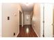Bright entryway with hardwood floors, staircase, and access to multiple rooms at 3819 Valleydale Dr, Durham, NC 27703