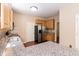 Bright kitchen features granite counters, stainless steel appliances, and wood cabinets at 3819 Valleydale Dr, Durham, NC 27703
