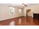 Spacious living room with hardwood floors, ceiling fan and fireplace at 3819 Valleydale Dr, Durham, NC 27703