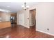 Open-concept living room with hardwood floors leads to a well-lit kitchen space at 3819 Valleydale Dr, Durham, NC 27703
