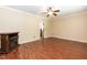 Open concept living room with hardwood floors, ceiling fan, and fireplace at 3819 Valleydale Dr, Durham, NC 27703