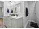 Bright bathroom features a double vanity with modern fixtures and a shower at 3908 Booker Ave, Durham, NC 27713