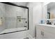 Modern bathroom with a tiled shower and sleek vanity at 3908 Booker Ave, Durham, NC 27713
