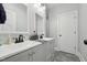 Bathroom features dual sinks with sleek black hardware and a large vanity at 3908 Booker Ave, Durham, NC 27713