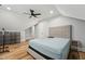 Spacious bedroom with natural light, a ceiling fan, and light-colored walls at 3908 Booker Ave, Durham, NC 27713
