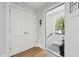 Light-filled entryway with tiled floor, and closet at 3908 Booker Ave, Durham, NC 27713