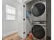 A laundry room equipped with a stacked washer and dryer unit for efficient space-saving at 3908 Booker Ave, Durham, NC 27713
