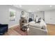 Inviting living area with hardwood floors, plush seating, and abundant natural light at 3908 Booker Ave, Durham, NC 27713