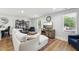 Bright living room with wood floors, comfortable seating, and entertainment center at 3908 Booker Ave, Durham, NC 27713