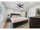 Serene bedroom featuring a comfortable bed and ample natural light at 3908 Booker Ave, Durham, NC 27713