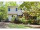 Charming home with a lush backyard featuring a deck and screened porch at 4 W Bridlewood Trl, Durham, NC 27713
