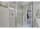 Modern bathroom with a glass-enclosed shower and a view into bedroom at 4 W Bridlewood Trl, Durham, NC 27713
