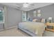 Comfortable bedroom with a large bed, soft carpet, and bright natural light at 4 W Bridlewood Trl, Durham, NC 27713