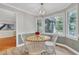Cozy breakfast nook with a wooden table, stylish light fixture, and a large window with a view at 4 W Bridlewood Trl, Durham, NC 27713