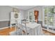 Inviting dining room featuring hardwood floors and table with seating for six at 4 W Bridlewood Trl, Durham, NC 27713