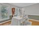 Charming dining room featuring hardwood floors, and ample natural light from the large window at 4 W Bridlewood Trl, Durham, NC 27713