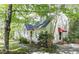 Well-maintained two-story home with a cozy front porch and mature landscaping at 4 W Bridlewood Trl, Durham, NC 27713
