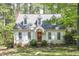 Charming cottage-style home with dormer windows, brick accents, and a landscaped front yard at 4 W Bridlewood Trl, Durham, NC 27713