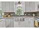 Bright kitchen featuring stainless steel appliances, granite countertops, and a large window at 4 W Bridlewood Trl, Durham, NC 27713