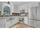 Modern kitchen featuring stainless steel appliances, granite countertops, and decorative backsplash at 4 W Bridlewood Trl, Durham, NC 27713