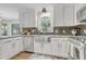 Stylish kitchen with stainless steel appliances, granite countertops, and updated cabinetry at 4 W Bridlewood Trl, Durham, NC 27713
