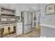 Well-appointed kitchen featuring stainless steel appliances, a modern oven, and hardwood floors at 4 W Bridlewood Trl, Durham, NC 27713