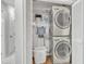 Convenient laundry room features a stacked washer and dryer at 4 W Bridlewood Trl, Durham, NC 27713