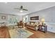Relaxing living room boasts hardwood floors, comfortable seating, and backyard access at 4 W Bridlewood Trl, Durham, NC 27713