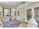 Inviting screened-in porch features outdoor seating, wood flooring, and access to the backyard at 4 W Bridlewood Trl, Durham, NC 27713