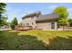Back exterior of home with wooden deck and fenced yard at 4112 Riverport Rd, Raleigh, NC 27616