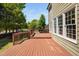 The expansive wooden deck is perfect for enjoying the outdoors and offers views of the manicured lawn at 4112 Riverport Rd, Raleigh, NC 27616