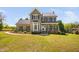 Charming two-story home featuring an inviting front porch and bay window at 4112 Riverport Rd, Raleigh, NC 27616