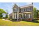 Charming two-story home featuring an inviting front porch and bay window at 4112 Riverport Rd, Raleigh, NC 27616