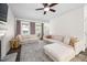 Inviting living room features ample seating, fireplace, and large windows, creating a warm and welcoming atmosphere at 4112 Riverport Rd, Raleigh, NC 27616
