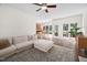 Spacious living room featuring hardwood floors, abundant natural light, and easy access to the dining area at 4112 Riverport Rd, Raleigh, NC 27616
