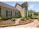 Exterior of home with a bay window and landscaped garden at 4112 Riverport Rd, Raleigh, NC 27616