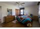 Bedroom showcasing hardwood floors, an ceiling fan, and a cozy quilt bedspread at 481 Firetower Rd, Louisburg, NC 27549