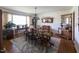 Traditional dining room with a large wood table, seating for eight, and classic decor elements under natural light at 481 Firetower Rd, Louisburg, NC 27549