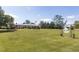 Expansive front yard with mature trees and charming address sign at 481 Firetower Rd, Louisburg, NC 27549