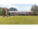 Well-maintained brick ranch with expansive front lawn and mature trees at 481 Firetower Rd, Louisburg, NC 27549