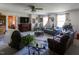 Bright living room with large windows, a fireplace, and comfortable seating perfect for relaxation and entertaining at 481 Firetower Rd, Louisburg, NC 27549