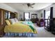 Bright main bedroom suite featuring a queen bed, closet and ample natural light for a comfortable and airy space at 481 Firetower Rd, Louisburg, NC 27549