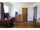 Office space features hardwood floors, desk and drawers near to a closed door at 481 Firetower Rd, Louisburg, NC 27549