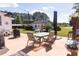 Expansive patio area with outdoor seating, overlooking a serene backyard at 481 Firetower Rd, Louisburg, NC 27549
