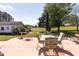 Expansive patio area with outdoor seating, overlooking a serene backyard at 481 Firetower Rd, Louisburg, NC 27549