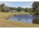 Calm pond with a wooden bridge offers a serene natural setting at 481 Firetower Rd, Louisburg, NC 27549