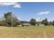 Vast, well-maintained property with mature trees and functional outbuildings at 481 Firetower Rd, Louisburg, NC 27549