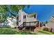 Spacious backyard featuring a wood deck with stairs, and a grassy area perfect for outdoor activities at 4828 Forest Highland Dr, Raleigh, NC 27604