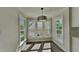 Sun-filled breakfast nook with windows all around and hanging light fixture at 4828 Forest Highland Dr, Raleigh, NC 27604